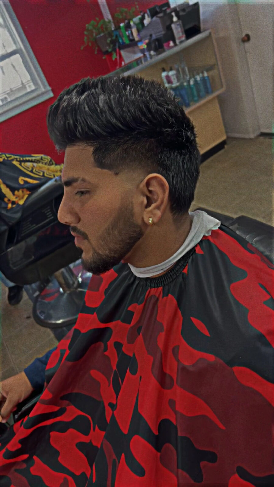 A client mid-cut at Romy's Hair Studio